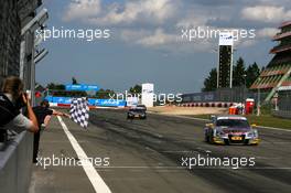 16.08.2009 Nürburg, Germany,  Martin Tomczyk (GER), Audi Sport Team Abt, Audi A4 DTM taking the chequered flag to win the race in front of Timo Scheider (GER), Audi Sport Team Abt, Audi A4 DTM and Mattias Ekström (SWE), Audi Sport Team Abt, Audi A4 DTM - DTM 2009 at Nürburgring, Germany