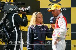 16.08.2009 Nürburg, Germany,  Race winner Martin Tomczyk (GER), Audi Sport Team Abt, being interviewed by his own girlfriend Christina Surer (SUI) for DTM TV - DTM 2009 at Nürburgring, Germany