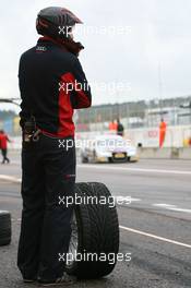 10.10.2009 Dijon, France,  Pitlane Feature: a mechanic waits for a car - DTM 2009 at Circuit Dijon Prenois, Dijon, France