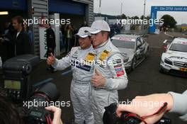 10.10.2009 Dijon, France,  Bruno Spengler (CAN), Team HWA AG, AMG Mercedes C-Klasse and Paul di Resta (GBR), Team HWA AMG Mercedes, AMG Mercedes C-Klasse posing for photographers - DTM 2009 at Circuit Dijon Prenois, Dijon, France