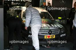 24.10.2009 Hockenheim, Germany,  Ralf Schumacher (GER), Team HWA AMG Mercedes, AMG Mercedes C-Klasse, looking at the damage on his car after an off track excursion - DTM 2009 at Hockenheimring, Hockenheim, Germany