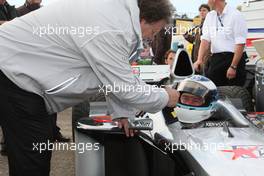 25.10.2009 Hockenheim, Germany,  Norbert Haug (GER), Sporting Director Mercedes-Benz and Mika Hakkinen (FIN) driving his old F1 car for some demo rounds - DTM 2009 at Hockenheimring, Hockenheim, Germany