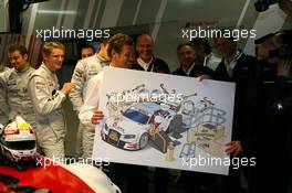 25.10.2009 Hockenheim, Germany,  All Mercedes drivers say farewell to fellow DTM driver Tom Kristensen (DNK), Audi Sport Team Abt, Audi A4 DTM and present him a cartoon painting - DTM 2009 at Hockenheimring, Hockenheim, Germany