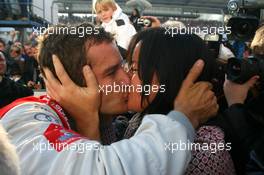 25.10.2009 Hockenheim, Germany,  2009 DTM champion Timo Scheider (GER), Audi Sport Team Abt, kisses his girlfriend Jasmin Rubatto (GER) - DTM 2009 at Hockenheimring, Hockenheim, Germany