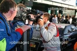 25.10.2009 Hockenheim, Germany,  2009 DTM champion Timo Scheider (GER), Audi Sport Team Abt, kissing the camera - DTM 2009 at Hockenheimring, Hockenheim, Germany