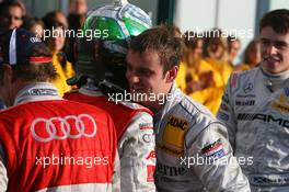 25.10.2009 Hockenheim, Germany,  Jamie Green (GBR), Persson Motorsport, AMG Mercedes C-Klasse, congratulates Timo Scheider (GER), Audi Sport Team Abt with his 2009 DTM championship - DTM 2009 at Hockenheimring, Hockenheim, Germany