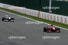 30.08.2009 Francorchamps, Belgium,  Kimi Raikkonen (FIN), Räikkönen, Scuderia Ferrari and Giancarlo Fisichella (ITA), Force India F1 Team  - Formula 1 World Championship, Rd 12, Belgian Grand Prix, Sunday Race
