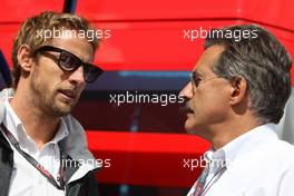 30.08.2009 Francorchamps, Belgium,  Jenson Button (GBR), BrawnGP talks to Dr. Mario Theissen (GER), BMW Sauber F1 Team, BMW Motorsport Director - Formula 1 World Championship, Rd 12, Belgian Grand Prix, Sunday