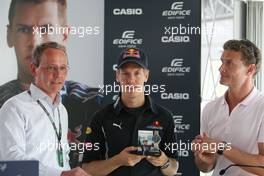 27.08.2009 Francorchamps, Belgium,  Sebastian Vettel (GER), Red Bull Racing with his new Casio signature watch, David Coulthard (GBR), Red Bull Racing, Consultant - Formula 1 World Championship, Rd 12, Belgian Grand Prix, Thursday