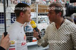 26.04.2009 Manama, Bahrain,   Kai Ebel (GER), TV interviews Sebastian Vettel (GER), Red Bull Racing - Formula 1 World Championship, Rd 4, Bahrain Grand Prix, Sunday Pre-Race Grid