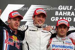 26.04.2009 Manama, Bahrain,  Sebastian Vettel (GER), Red Bull Racing, Jenson Button (GBR), Brawn GP, Jarno Trulli (ITA), Toyota Racing - Formula 1 World Championship, Rd 4, Bahrain Grand Prix, Sunday Podium