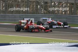 26.04.2009 Manama, Bahrain,  Kimi Raikkonen (FIN), Räikkönen, Scuderia Ferrari and Timo Glock (GER), Toyota F1 Team  - Formula 1 World Championship, Rd 4, Bahrain Grand Prix, Sunday Race