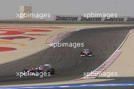 26.04.2009 Manama, Bahrain,  Timo Glock (GER), Toyota F1 Team, TF109 and Jarno Trulli (ITA), Toyota Racing, TF109 - Formula 1 World Championship, Rd 4, Bahrain Grand Prix, Sunday Race