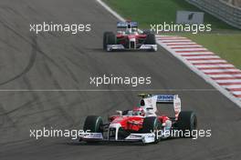 26.04.2009 Manama, Bahrain,  Timo Glock (GER), Toyota F1 Team, TF109 and Jarno Trulli (ITA), Toyota Racing, TF109 - Formula 1 World Championship, Rd 4, Bahrain Grand Prix, Sunday Race