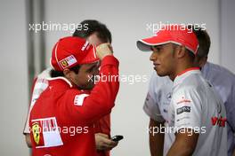 16.10.2009 Sao Paulo, Brazil,  Felipe Massa (BRA), Scuderia Ferrari shows Lewis Hamilton (GBR), McLaren Mercedes his scars - Formula 1 World Championship, Rd 16, Brazilian Grand Prix, Friday Press Conference