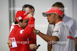 16.10.2009 Sao Paulo, Brazil,  Felipe Massa (BRA), Scuderia Ferrari shows Lewis Hamilton (GBR), McLaren Mercedes his scars - Formula 1 World Championship, Rd 16, Brazilian Grand Prix, Friday Press Conference