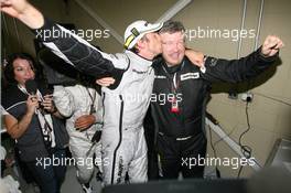 18.10.2009 Sao Paulo, Brazil,  Jenson Button (GBR), BrawnGP wins the world championship kisses Ross Brawn  - Formula 1 World Championship, Rd 16, Brazilian Grand Prix, Sunday Podium