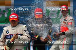 18.10.2009 Sao Paulo, Brazil,  Robert Kubica (POL), BMW Sauber F1 Team, Mark Webber (AUS), Red Bull Racing  and Lewis Hamilton (GBR), McLaren Mercedes  - Formula 1 World Championship, Rd 16, Brazilian Grand Prix, Sunday Podium