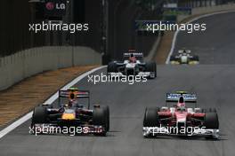 18.10.2009 Sao Paulo, Brazil,  Sebastian Vettel (GER), Red Bull Racing and Kamui Kobayashi (JAP), Toyota F1 Team  - Formula 1 World Championship, Rd 16, Brazilian Grand Prix, Sunday Race