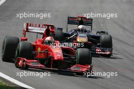 18.10.2009 Sao Paulo, Brazil,  Giancarlo Fisichella (ITA), Scuderia Ferrari and Jaime Alguersuari (ESP), Scuderia Toro Rosso  - Formula 1 World Championship, Rd 16, Brazilian Grand Prix, Sunday Race