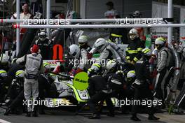 18.10.2009 Sao Paulo, Brazil,  Jenson Button (GBR), Brawn GP during pitstop - Formula 1 World Championship, Rd 16, Brazilian Grand Prix, Sunday Race