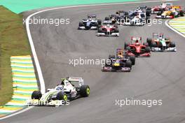 18.10.2009 Sao Paulo, Brazil,  Rubens Barrichello (BRA), BrawnGP leads the start of the race - Formula 1 World Championship, Rd 16, Brazilian Grand Prix, Sunday Race