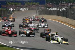 18.10.2009 Sao Paulo, Brazil,  Rubens Barrichello (BRA), BrawnGP  leads the start of the race - Formula 1 World Championship, Rd 16, Brazilian Grand Prix, Sunday Race