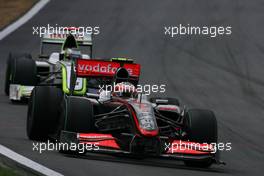 Heikki Kovalainen (FIN), McLaren Mercedes and Jenson Button (GBR), Brawn GP  - Formula 1 World Championship, Rd 16, Brazilian Grand Prix, Sunday Race
