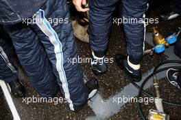 19.04.2009 Shanghai, China,  Sebastian Vettel (GER), Red Bull Racing with special covers for his shoes to keep the racing shoes dry - Formula 1 World Championship, Rd 3, Chinese Grand Prix, Sunday Pre-Race Grid