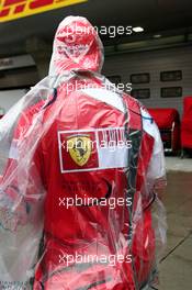 19.04.2009 Shanghai, China,  A Ferrari fan with rain cover - Formula 1 World Championship, Rd 3, Chinese Grand Prix, Sunday
