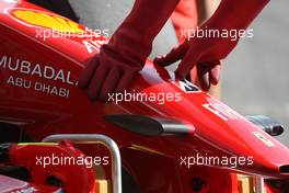 08.05.2009 Barcelona, Spain,  A Ferrari mechanic with KERS cloves - Formula 1 World Championship, Rd 5, Spanish Grand Prix, Friday Practice