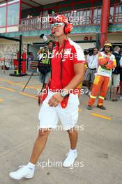 21.08.2009 Valencia, Spain,  Michael Schumacher (GER), Test Driver, Scuderia Ferrari on the way to pit wall - Formula 1 World Championship, Rd 11, European Grand Prix, Friday Practice