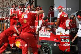 21.08.2009 Valencia, Spain,  Michael Schumacher (GER), Test Driver, Scuderia Ferrari looks at the car of Kimi Raikkonen (FIN), Räikkönen, Scuderia Ferrari  - Formula 1 World Championship, Rd 11, European Grand Prix, Friday Practice