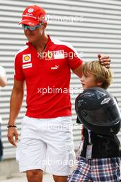 21.08.2009 Valencia, Spain,  Michael Schumacher (GER), Test Driver, Scuderia Ferrari on the way to pit wall - Formula 1 World Championship, Rd 11, European Grand Prix, Friday Practice