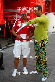 21.08.2009 Valencia, Spain,  Michael Schumacher (GER), Scuderia Ferrari, meets Kai Ebel (RTL TV) shows his new whatch collection - Formula 1 World Championship, Rd 11, European Grand Prix, Friday Practice