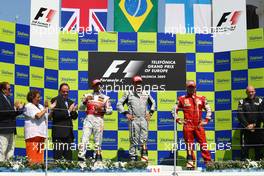 23.08.2009 Valencia, Spain,  1st place Rubens Barrichello (BRA), Brawn GP with 2nd place Lewis Hamilton (GBR), McLaren Mercedes and 3rd place Kimi Raikkonen (FIN), Räikkönen, Scuderia Ferrari - Formula 1 World Championship, Rd 11, European Grand Prix, Sunday Podium