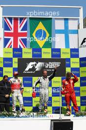 23.08.2009 Valencia, Spain,  1st place Rubens Barrichello (BRA), Brawn GP with 2nd place Lewis Hamilton (GBR), McLaren Mercedes and 3rd place Kimi Raikkonen (FIN), Räikkönen, Scuderia Ferrari - Formula 1 World Championship, Rd 11, European Grand Prix, Sunday Podium