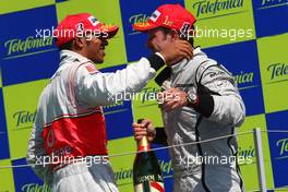 23.08.2009 Valencia, Spain,  Lewis Hamilton (GBR), McLaren Mercedes and 1st place Rubens Barrichello (BRA), Brawn GP - Formula 1 World Championship, Rd 11, European Grand Prix, Sunday Podium