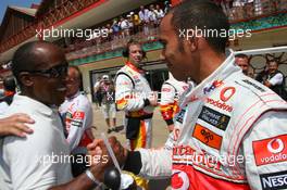 22.08.2009 Valencia, Spain,  Anthony Hamilton (GBR), Father of Lewis Hamilton congratulates Lewis Hamilton (GBR), McLaren Mercedes on his pole position - Formula 1 World Championship, Rd 11, European Grand Prix, Saturday Qualifying