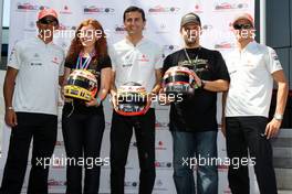 20.08.2009 Valencia, Spain,  Lewis Hamilton (GBR), McLaren Mercedes, Pedro de la Rosa (ESP), Test Driver, McLaren Mercedes, Heikki Kovalainen (FIN), McLaren Mercedes, helmets have the name of Johnny Walker prize winners - Formula 1 World Championship, Rd 11, European Grand Prix, Thursday