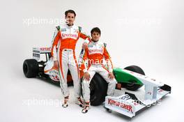 24.02.2009 Silverstone, England, (L to R): Adrian Sutil (GER) with Force India F1 team mate Giancarlo Fisichella (ITA) alongside the Force India F1 VJM02. Force India F1 VJM02 Launch Studio Shoot, Silverstone, England, 24 February 2009 - Force India, VJM02 - Shakedown