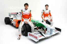 24.02.2009 Silverstone, England, (L to R): Adrian Sutil (GER) with Force India F1 team mate Giancarlo Fisichella (ITA) alongside the Force India F1 VJM02. Force India F1 VJM02 Launch Studio Shoot, Silverstone, England, 24 February 2009 - Force India, VJM02 - Shakedown