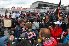 21.06.2009 Silverstone, England,  Sebastian Vettel (GER), Red Bull Racing surraounded by TV Cameras - Formula 1 World Championship, Rd 8, British Grand Prix, Sunday Pre-Race Grid