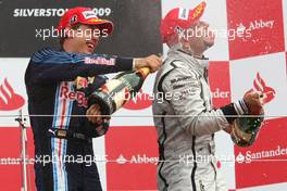 21.06.2009 Silverstone, England,  1st place Sebastian Vettel (GER), Red Bull Racing and Rubens Barrichello (BRA), Brawn GP - Formula 1 World Championship, Rd 8, British Grand Prix, Sunday Podium