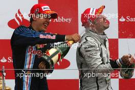 21.06.2009 Silverstone, England,  Sebastian Vettel (GER), Red Bull Racing and Rubens Barrichello (BRA), Brawn GP  - Formula 1 World Championship, Rd 8, British Grand Prix, Sunday Podium