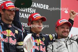 21.06.2009 Silverstone, England,  Mark Webber (AUS), Red Bull Racing, 3rd, Sebastian Vettel (GER), Red Bull Racing, 1st, Rubens Barrichello (BRA), Brawn GP, 2nd - Formula 1 World Championship, Rd 8, British Grand Prix, Sunday Podium
