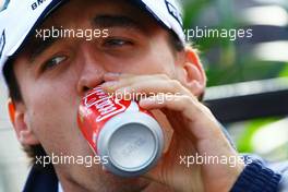 20.06.2009 Silverstone, England,  Robert Kubica (POL),  BMW Sauber F1 Team drinking a Coke (Coca Cola) - Formula 1 World Championship, Rd 8, British Grand Prix, Saturday