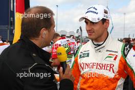 12.07.2009 Nürburg, Germany,  Kai Ebel (TV RTL) and Adrian Sutil (GER), Force India F1 Team - Formula 1 World Championship, Rd 9, German Grand Prix, Sunday Pre-Race Grid