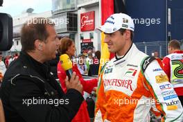 12.07.2009 Nürburg, Germany,  Kai Ebel (TV RTL) and Adrian Sutil (GER), Force India F1 Team - Formula 1 World Championship, Rd 9, German Grand Prix, Sunday Pre-Race Grid