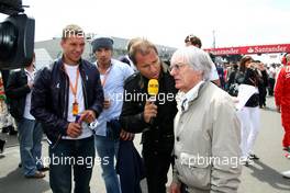 12.07.2009 Nürburg, Germany,  Lukas Podolski (soccer player), Kai Ebel (RTL, TV) and Bernie Ecclestone (GBR), President and CEO of Formula One Management - Formula 1 World Championship, Rd 9, German Grand Prix, Sunday Pre-Race Grid